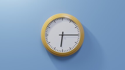 Glossy orange clock on a blue wall at quarter past six. Time is 06:15 or 18:15