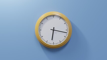 Glossy orange clock on a blue wall at seventeen past six. Time is 06:17 or 18:17