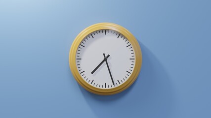 Glossy orange clock on a blue wall at twenty-seven past seven. Time is 07:27 or 19:27