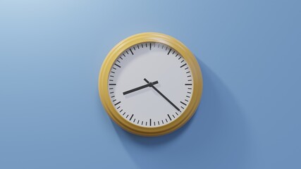 Glossy orange clock on a blue wall at twenty-two past eight. Time is 08:22 or 20:22