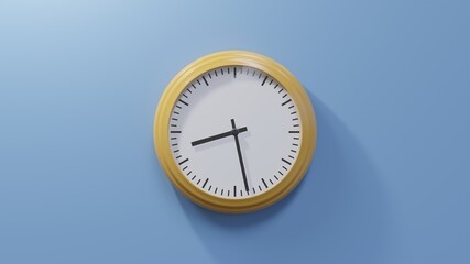 Glossy orange clock on a blue wall at twenty-eight past eight. Time is 08:28 or 20:28