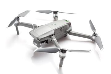 Modern drone quadcopter with a camera isolated on white background