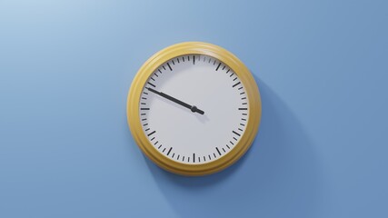 Glossy orange clock on a blue wall at forty-nine past nine. Time is 09:49 or 21:49