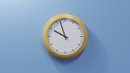 Glossy orange clock on a blue wall at fifty-seven past nine. Time is 09:57 or 21:57