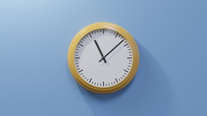 Glossy orange clock on a blue wall at eight past eleven. Time is 11:08 or 23:08