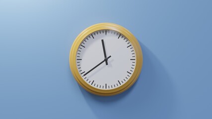 Glossy orange clock on a blue wall at thirty-nine past eleven. Time is 11:39 or 23:39