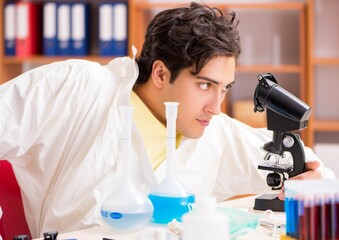 Young biochemist working in the lab