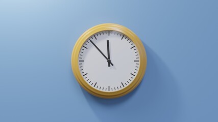 Glossy orange clock on a blue wall at fifty-three past eleven. Time is 11:53 or 23:53
