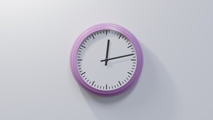 Glossy pink clock on a white wall at thirteen past twelve. Time is 00:13 or 12:13