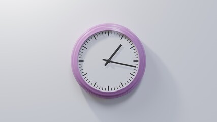 Glossy pink clock on a white wall at seventeen past one. Time is 01:17 or 13:17