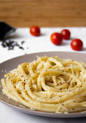 Spaghetti with cheese and pepper close-up