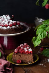 delicious homemade Chocolate cheesecake with fresh raspberries