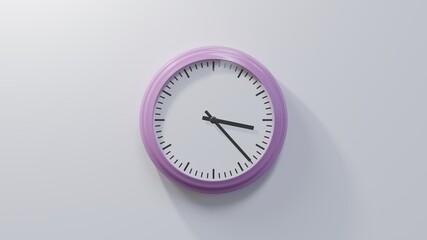 Glossy pink clock on a white wall at twenty-three past three. Time is 03:23 or 15:23