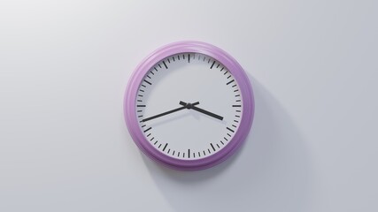 Glossy pink clock on a white wall at forty-two past three. Time is 03:42 or 15:42