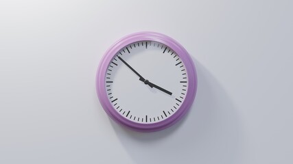 Glossy pink clock on a white wall at fifty-two past three. Time is 03:52 or 15:52