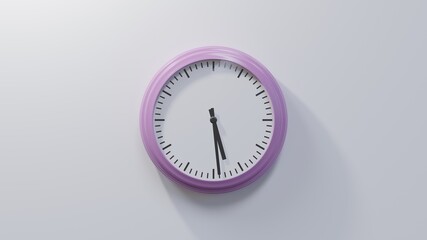 Glossy pink clock on a white wall at twenty-nine past five. Time is 05:29 or 17:29