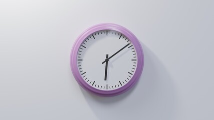 Glossy pink clock on a white wall at nine past six. Time is 06:09 or 18:09