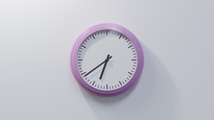 Glossy pink clock on a white wall at thirty-nine past six. Time is 06:39 or 18:39