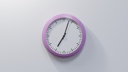 Glossy pink clock on a white wall at three past seven. Time is 07:03 or 19:03