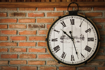 Fototapeta na wymiar old clocks on the brick wall - time, time change, timeless