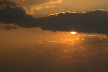 The sun at sunset and, slightly covering it, clouds (option 7)