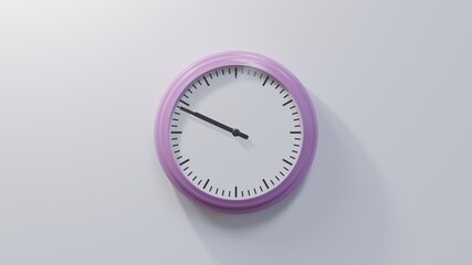 Glossy pink clock on a white wall at forty-nine past nine. Time is 09:49 or 21:49