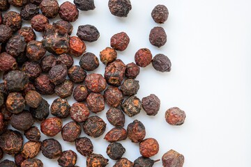 Dried cherries scattered on a white background. Vitamins for the winter.