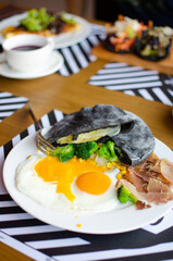 black pita on a white plate. Serving a Mediterranean breakfast. national street food. Fresh tasty ingredients.