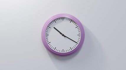 Glossy pink clock on a white wall at twenty past ten. Time is 10:20 or 22:20