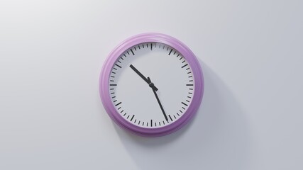 Glossy pink clock on a white wall at twenty-six past ten. Time is 10:26 or 22:26