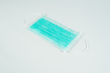 Doctor mask protection isolated on a white background with blur and shallow depth of field focus.