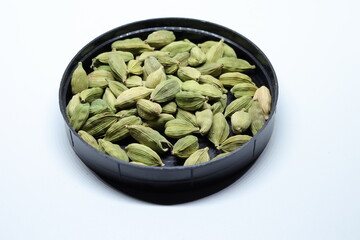 Green Dried cardamom seeds isolated on white background
