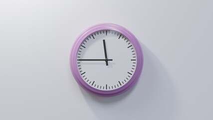 Glossy pink clock on a white wall at quarter to zero. Time is 11:45 or 23:45