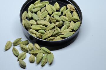 Green Dried cardamom seeds isolated on white background