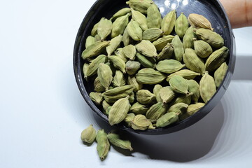 Green Dried cardamom seeds isolated on white background