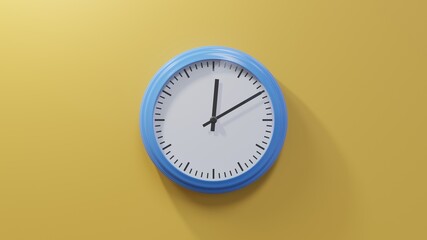 Glossy blue clock on a orange wall at ten past twelve. Time is 00:10 or 12:10