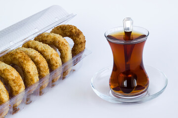 Traditional Turkish Holy Sesame Rings,Kandil Simidi on white with tea.
