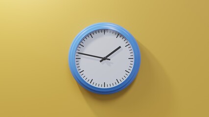Glossy blue clock on a orange wall at forty-seven past one. Time is 01:47 or 13:47