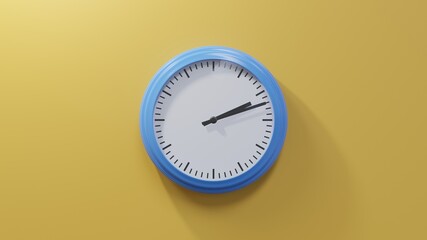Glossy blue clock on a orange wall at twelve past two. Time is 02:12 or 14:12