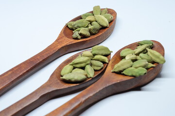 Green Dried cardamom seeds isolated on white background