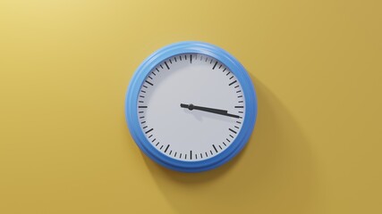 Glossy blue clock on a orange wall at seventeen past three. Time is 03:17 or 15:17