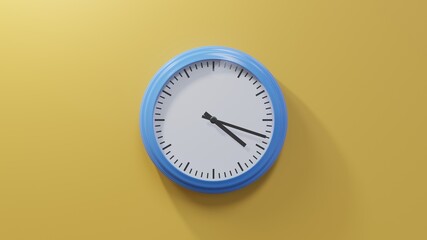 Glossy blue clock on a orange wall at eighteen past four. Time is 04:18 or 16:18