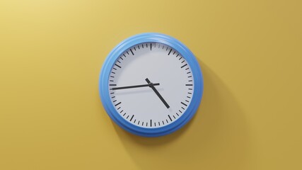 Glossy blue clock on a orange wall at forty-four past four. Time is 04:44 or 16:44