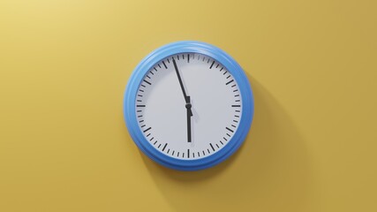 Glossy blue clock on a orange wall at fifty-seven past five. Time is 05:57 or 17:57