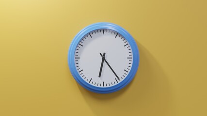 Glossy blue clock on a orange wall at twenty-four past six. Time is 06:24 or 18:24