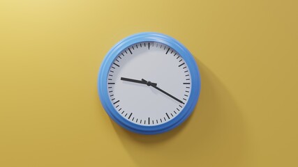 Glossy blue clock on a orange wall at twenty past nine. Time is 09:20 or 21:20