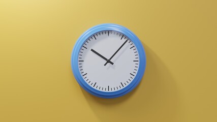 Glossy blue clock on a orange wall at seven past ten. Time is 10:07 or 22:07