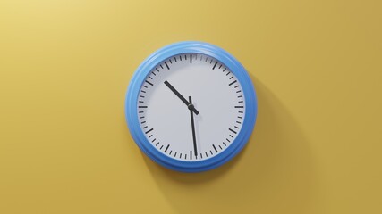 Glossy blue clock on a orange wall at twenty-nine past ten. Time is 10:29 or 22:29