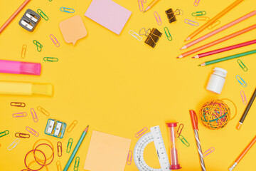 Back to school concept, school supplies on yellow background, university, college, flat lay with copy space