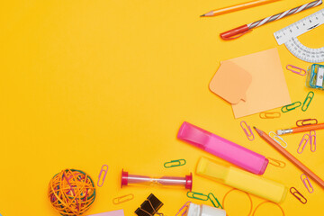 Back to school concept, school supplies on yellow background, university, college, flat lay with copy space